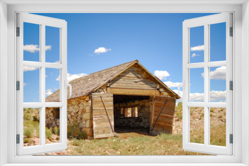Fototapeta Naklejka Na Ścianę Okno 3D - USA, Nevada, Nye County, Monitor Valley, Potts Ranch. An amandoned stone garage style stable building at this old homestead site.