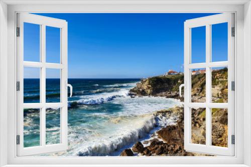 Fototapeta Naklejka Na Ścianę Okno 3D - View of cliff top villas and the Atlantic ocean waves on a sunny summer day, taken in Praia das Maçãs, Sintra, Portugal