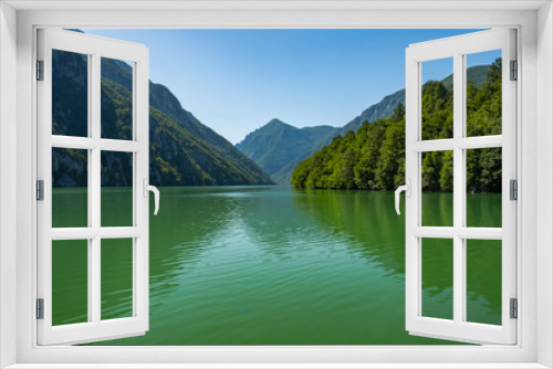 Fototapeta Naklejka Na Ścianę Okno 3D - Lake in mountains with green clean water
