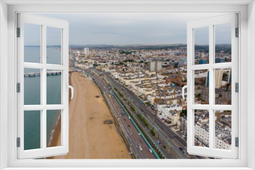 Aerial photo of the Brighton beach and coastal area located in the south coast of England UK that is part of the City of Brighton and Hove, taken on a bright sunny day