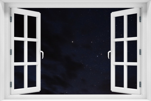 Fototapeta Naklejka Na Ścianę Okno 3D - Stars in the night sky through the clouds