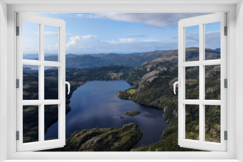 Fototapeta Naklejka Na Ścianę Okno 3D - Stavanger (Norway) Die Natur Norwegens , Drohnen Foto , mit See und Sicht auf Felsen bei blauem Himmel mit kleinen Norwegischen Häusern , Beauty of Norway	