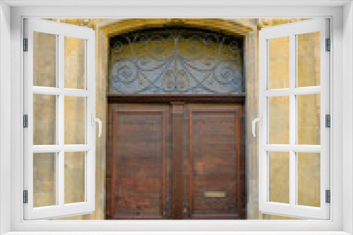  facade of mediterranean building with wooden door 