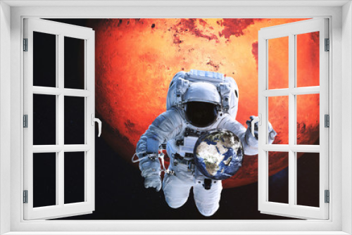 Fototapeta Naklejka Na Ścianę Okno 3D - Astronaut in a front of Earth with flying shuttle near Mars planet. Elements of the image were furnished by NASA