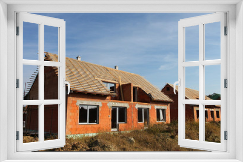 Fototapeta Naklejka Na Ścianę Okno 3D - Construction of semi-detached houses in the suburbs