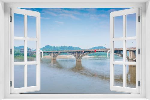 Fototapeta Naklejka Na Ścianę Okno 3D - A view of the Weijiang Bridge in Leshan City, Sichuan Province, China