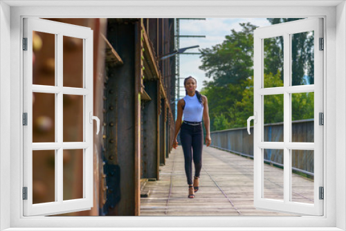 Trendy athletic young African woman laughing