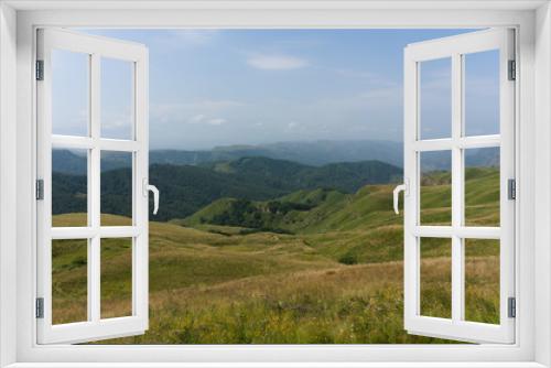 Gumbashi pass view in the russian caucasus, green meadow landscape at an altitude of above 2000 m