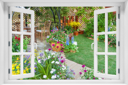Fototapeta Naklejka Na Ścianę Okno 3D - Lush landscaped backyard flower garden