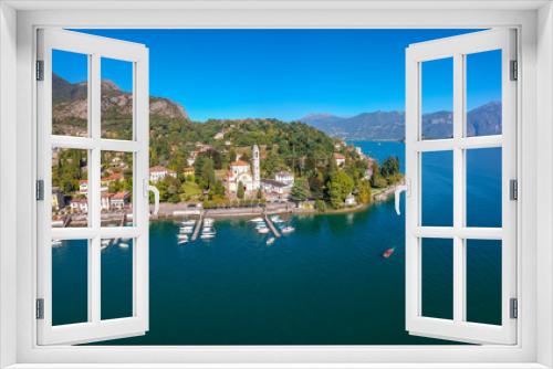 Fototapeta Naklejka Na Ścianę Okno 3D - Aerial view landscape on beatiful Lake Como in Tremezzina, Lombardy, Italy. Scenic small town with traditional houses and clear blue water. Summer tourist vacation on rich resort with nice harbour