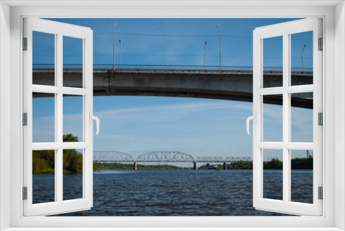 Fototapeta Naklejka Na Ścianę Okno 3D - bridge across the river on a Sunny day, view from the water,
