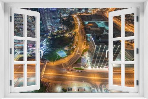 Fototapeta Naklejka Na Ścianę Okno 3D - Traffic on the road in Jumeirah Lakes Towers district aerial night timelapse.
