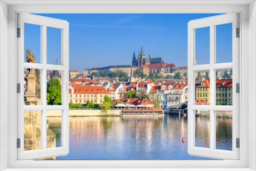 Fototapeta Naklejka Na Ścianę Okno 3D - A view across the Charles Bridge and the Vltava River to Prague Castle and St. Vitas Cathedral in Prague, Czech Republic.