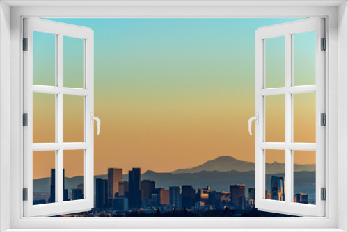 Fototapeta Naklejka Na Ścianę Okno 3D - Denver skyline against a background of mountains