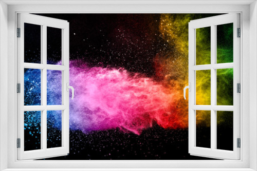 Fototapeta Naklejka Na Ścianę Okno 3D - Abstract multicolored powder explosion on black background. Color dust particle splattered on background.