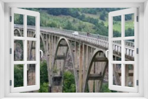 Fototapeta Naklejka Na Ścianę Okno 3D - a large bridge between the hills