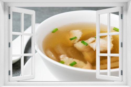 Fototapeta Naklejka Na Ścianę Okno 3D - Radish soup with pork and scallion in white bowl on table.