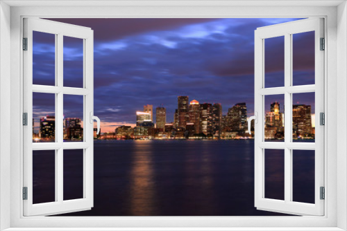 Fototapeta Naklejka Na Ścianę Okno 3D - Boston skyline at night, with skyscrapers reflection on the ocean, Massachusetts, USA