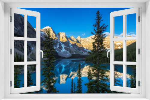 Fototapeta Naklejka Na Ścianę Okno 3D - Beautiful sunrise under turquoise waters of the Moraine lake in Canadian Rockies, Banff National Park, Canada
