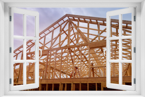 Fototapeta Naklejka Na Ścianę Okno 3D - Building construction, wood framing new home under construction roof being built