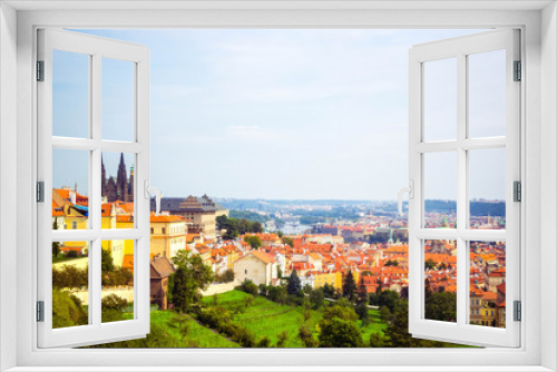 Fototapeta Naklejka Na Ścianę Okno 3D - Panoramic view of Prague (Prague Castle, St. Vitus Cathedral) from Petrin hill.  Beautiful summer landscape with blooming gardens, Prague, Czech Republic