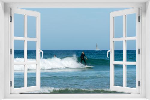 Fototapeta Naklejka Na Ścianę Okno 3D - teenager surfing on the west coast of Brittany in France at Toulinguet Beach near Camaret-Sur-Mer