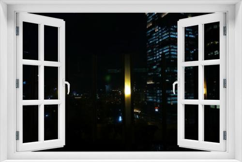 Fototapeta Naklejka Na Ścianę Okno 3D - The light in the windows of an municipal building by night, darkness