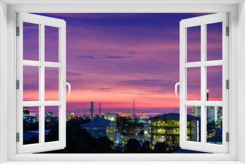 Fototapeta Naklejka Na Ścianę Okno 3D - Sunset sky view with petrochemical industry estate, glitter lighting factory of petroleum industrial plant on sky sunset background