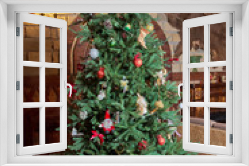 Fototapeta Naklejka Na Ścianę Okno 3D - Beautiful christmas tree isolated . Christmas tree in an old home . Decorated Christmas tree .