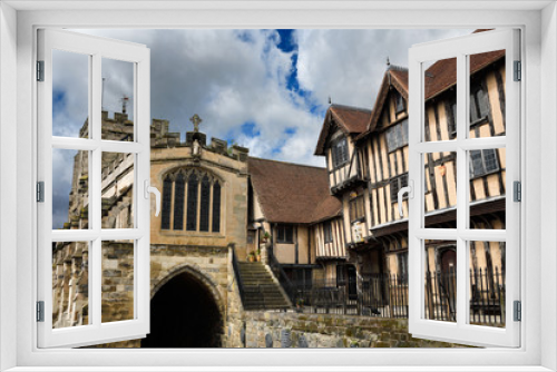 Fototapeta Naklejka Na Ścianę Okno 3D - Crooked Lord Leycester Hospital buildings for ex-servicemen at West Gate with 12th Century Chapel of St James on High Street Warwick England