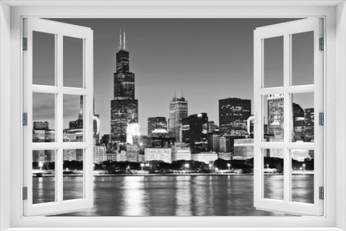 Fototapeta Naklejka Na Ścianę Okno 3D - View of Chicago skyline from the shore of Lake Michigan at night.