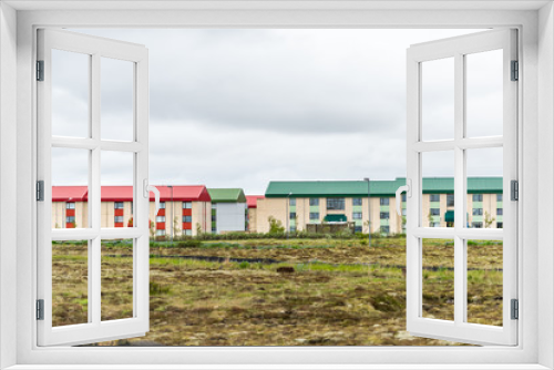 Fototapeta Naklejka Na Ścianę Okno 3D - Iceland hotel or apartment colorful houses in Scandinavian city with multicolored red green on painted roof