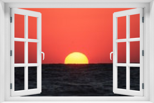 Fototapeta Naklejka Na Ścianę Okno 3D - a sunrise at the seashore in red colors