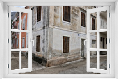 Fototapeta Naklejka Na Ścianę Okno 3D - Old house with brown shutters in the mediterrenean city
