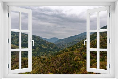 Fototapeta Naklejka Na Ścianę Okno 3D - Autumn landscape view in Rhodope Mountains with green, yellow and orange leafs 