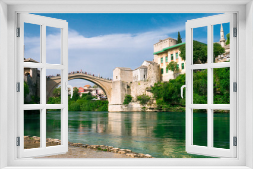  April 2019, Mostar, Bosnia and Herzegovina. The Old Bridge, Stari Most, with emerald river Neretva.