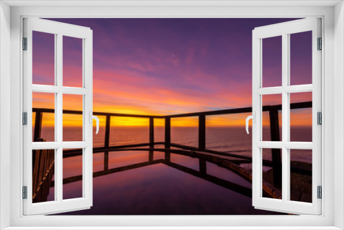 Fototapeta Naklejka Na Ścianę Okno 3D - An amazing an idyllic view a wooden hot tub waiting us for some relaxation time during sunset and twilight before an awe night sky with a small crescent moon. A leisure activity at Chilean coastline