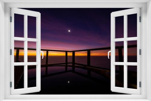 Fototapeta Naklejka Na Ścianę Okno 3D - An amazing an idyllic view a wooden hot tub waiting us for some relaxation time during sunset and twilight before an awe night sky with a small crescent moon. A leisure activity at Chilean coastline