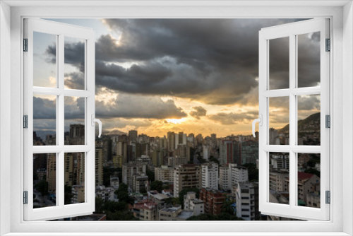 Fototapeta Naklejka Na Ścianę Okno 3D - View of Caracas city from west side during a sunset. Venezuela