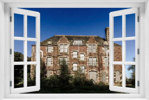 Fototapeta Naklejka Na Ścianę Okno 3D - Side view of the Nurses Home at Bangour Village Hospital; Dechmont, near Livingston, Scotland.  The site has been unused since the last patients in 2004.