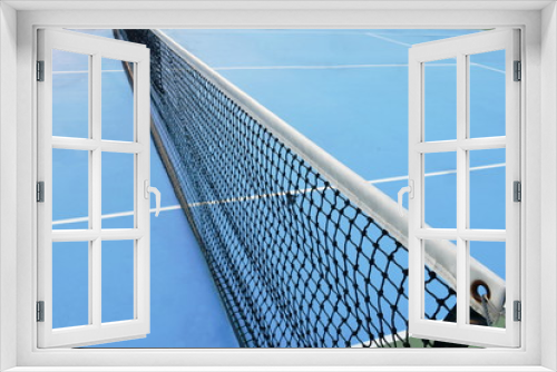 Fototapeta Naklejka Na Ścianę Okno 3D - net of tennis court with white border line on blue floor