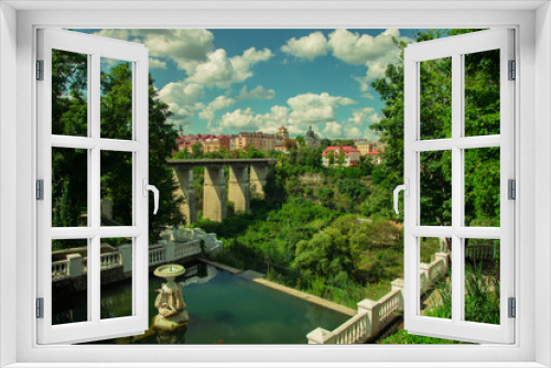 Fototapeta Naklejka Na Ścianę Okno 3D - beautiful old Europe landmark landscape view of medieval city outskirts space with park outdoor foreground of pool with small fountain  surrounded by classic marble fence and green trees foliage 