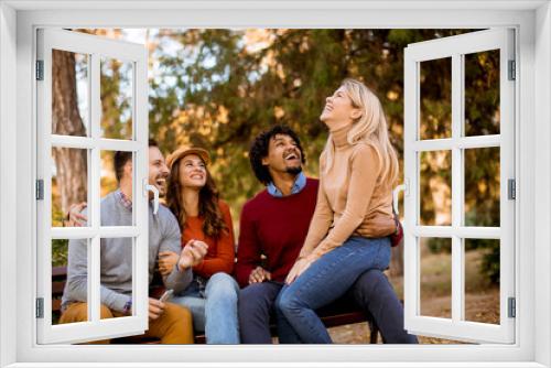 Group of young multiethnic friends having fun at park