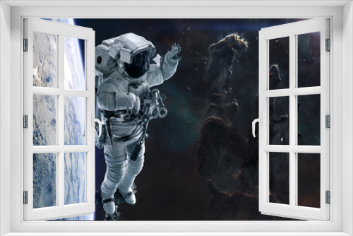 Fototapeta Naklejka Na Ścianę Okno 3D - Pillars of Creation, astronaut, planet in deep space. Science fiction. Elements of this image furnished by NASA