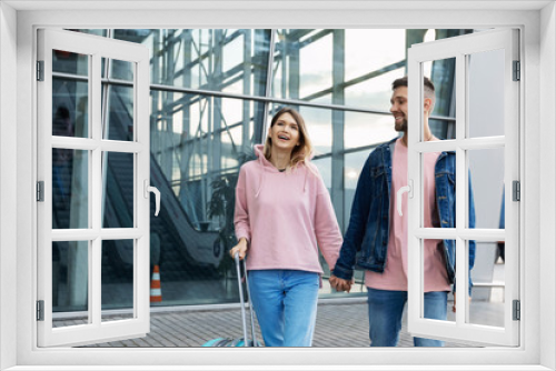 Couple At Airport. Happy Young People Traveling Together