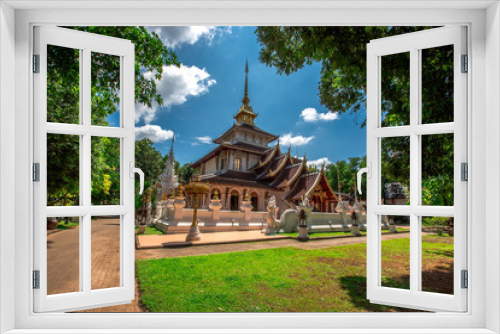 Fototapeta Naklejka Na Ścianę Okno 3D - background,Open view of the temple at Dara Pirom Temple (Mae Rim),which has a large statue in front of the temple. Covered by trees and sky, Chiang Mai Province, Thailand, Wat Pa Daphirom