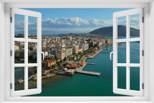 Fototapeta Naklejka Na Ścianę Okno 3D - Aerial drone photo of famous seaside town of Halkida or Chalkida with beautiful clouds and deep blue sky featuring old bridge connecting Evia island with mainland Greece