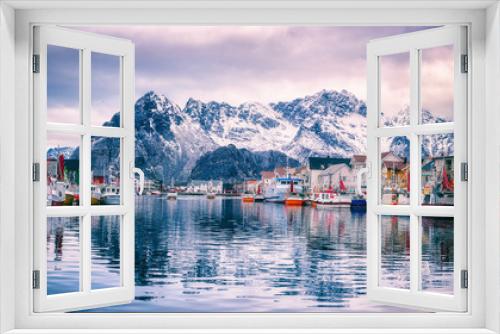 Fototapeta Naklejka Na Ścianę Okno 3D - Fishing boats at harbour of cozy small fishing village Henningsvaer in Lofoten Islands, Northern Norway. Amazing landscape with mountains and reflection in the water, travel winter background