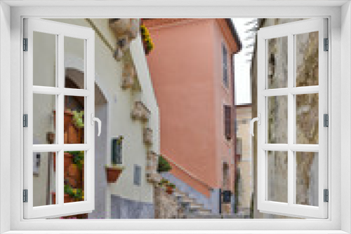 Fototapeta Naklejka Na Ścianę Okno 3D - Monte San Biagio, Italy, 03/24/2018. A street among the old houses of a village in the Lazio region.