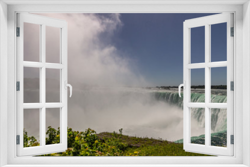 Fototapeta Naklejka Na Ścianę Okno 3D - Niagara Falls park and the mist from the fall